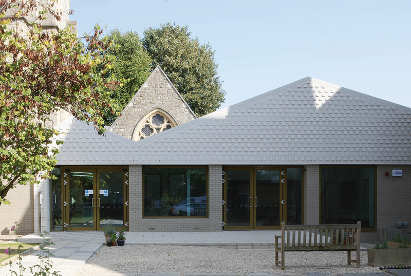 St Mary’s Centre from the front; grey brick at ground level relates to the original church but is also designed to put people at ease, while the white brick above is more robust.