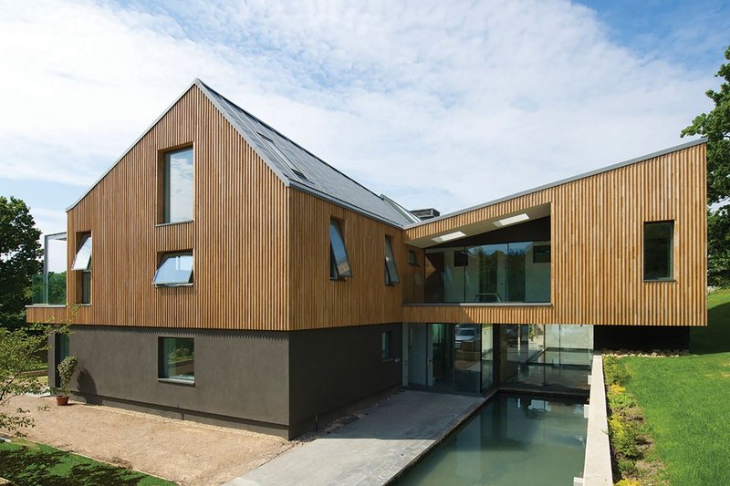 View of New House looking south west, showing the north bedroom block projecting above the main entrance lobby.