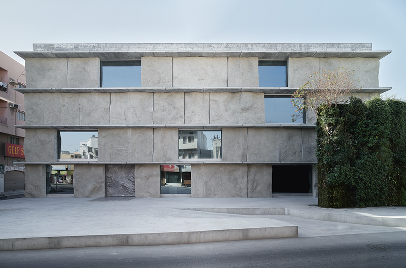 House of cards exterior and honed rock interior at Green Corner Building.