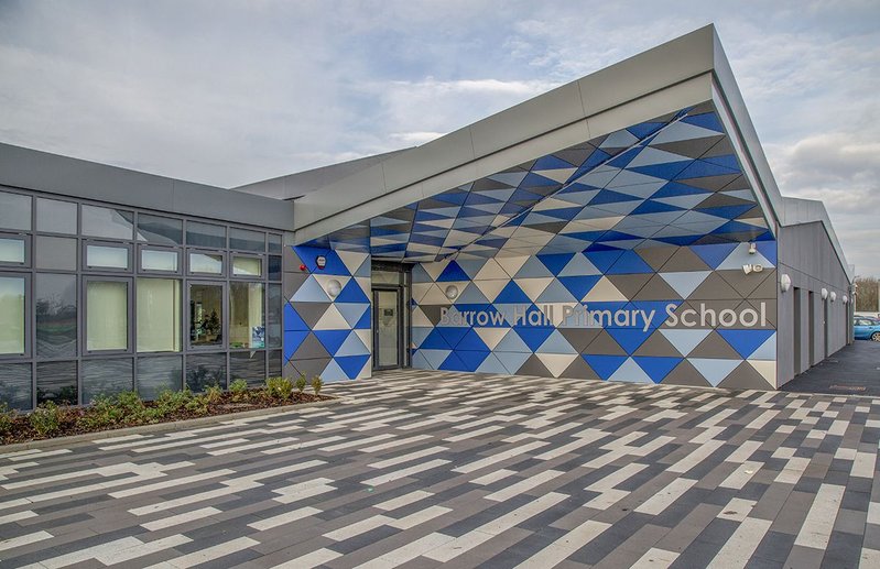 The new look Barrow Hall Primary School near Warrington designed by Ellis Williams Architects with its bright Formica Group rainscreen cladding.