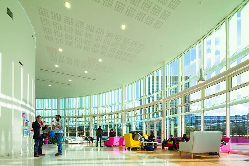 The double height main reception area of the Glass Mill Centre, looking east. First impressions count and LA Architects has concentrated resources here to create a bright voluminous and high quality space.