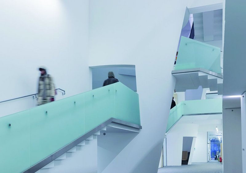 Three types of balustrade stalk the building: mesh, delicately boarded concrete and, shown here, the bead-blasted glass as used on the facade.