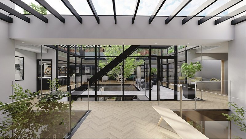 Atrium entrance with glazed roof and views into courtyard.