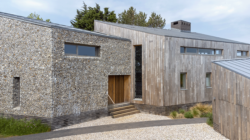 The three volumes of the building were inspired by the patterns in the bark of a tree, but also the client’s desire to build something interesting.