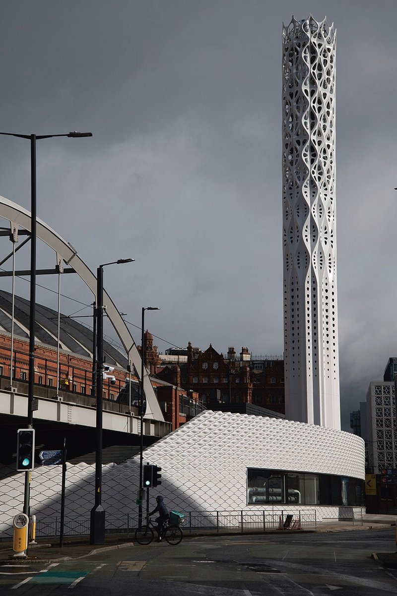 The Tower of Light, sandwiched between road and tramline.