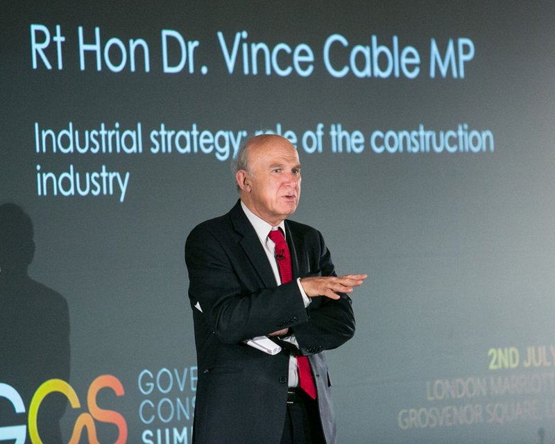 Vince cable puts his views to the audience at the Government Construction Summit.