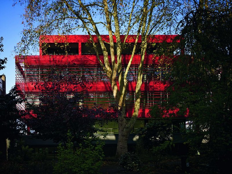 A new set of louvres wraps south and south-east facades, seen here from the neighbouring patch of park.