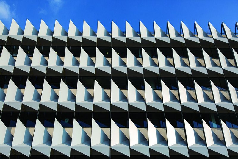 Folded steel insulation on the facade of Sheppard Robson’s Masdar City HQ for Siemens