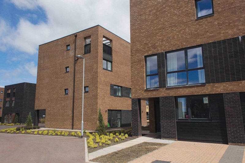 Stallan Brand’s four storey ‘Cube’ apartment blocks: simple, bold forms helping to create the village’s sense of place.