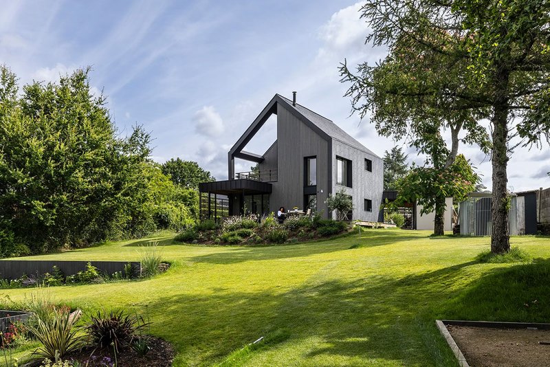 Cupaclad Waterfall cladding at Treetops in the Loire Valley: 'The natural slate is orientated vertically to create an optical illusion of cascading water'.