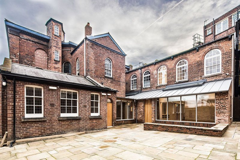 The backs of the two chapel buildings now form a proper heart to the complex. The Hollis Building Sheffield, Chiles Evans and Care architects, RIBA regional award and small project of the year 2019. Credit Dug Wilders