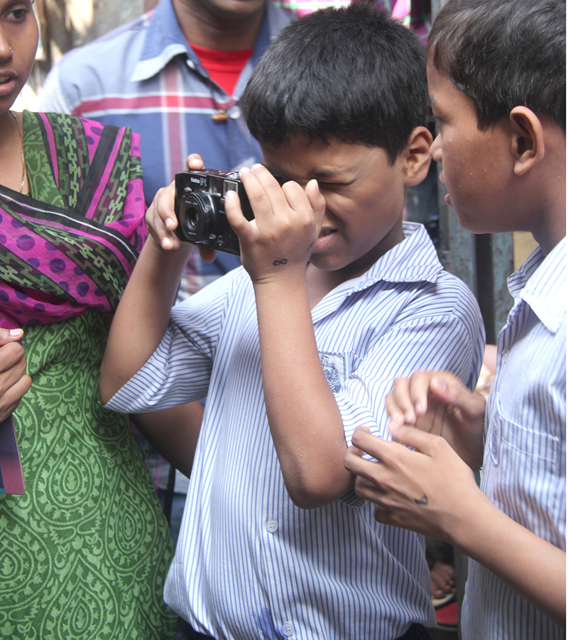 The class document their neighbourhood during a Walkabout workshop, 2014.