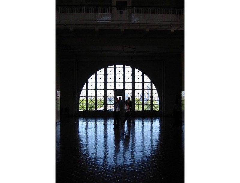 The distinctive windows of the National Immigration Museum, Ellis Island, New York, where 12 million arrivals had their first tantalising sight of the streets of Manhattan, 2002. Photograph by Dinah Casson
