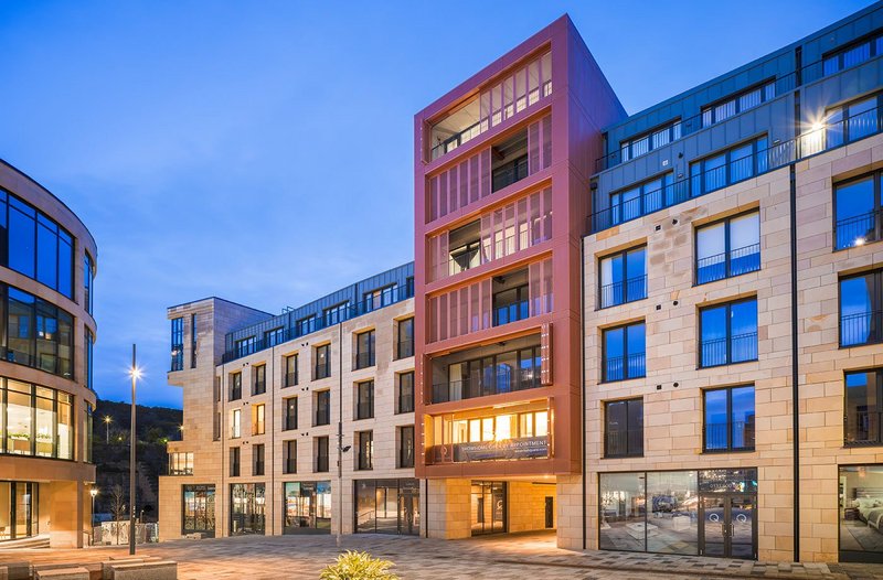 New Waverley residential and retail block with red Anvil perforated metal cladding supplied by Taylor Maxwell: 'Bringing new houses and  people to live back in the city centre is an important aspect of the regeneration.'