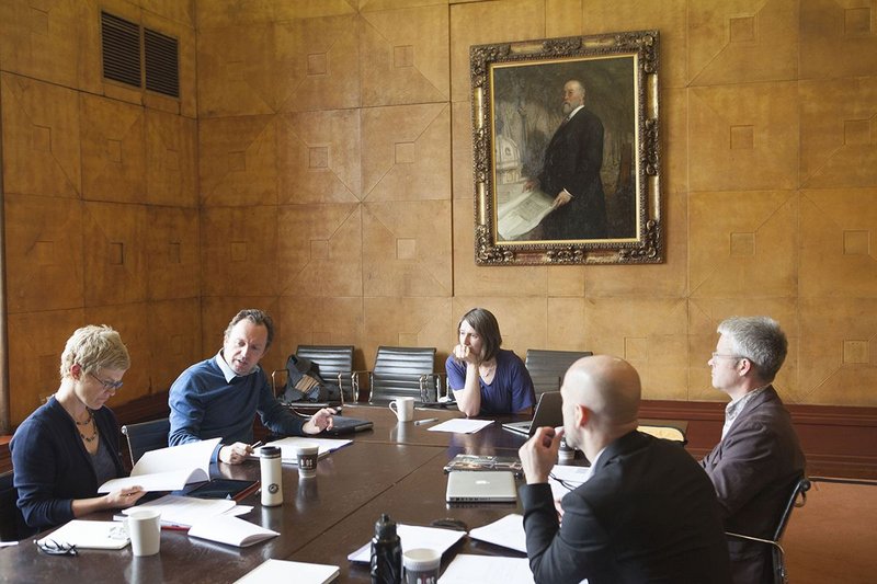 Dissertation judges discuss the entries.