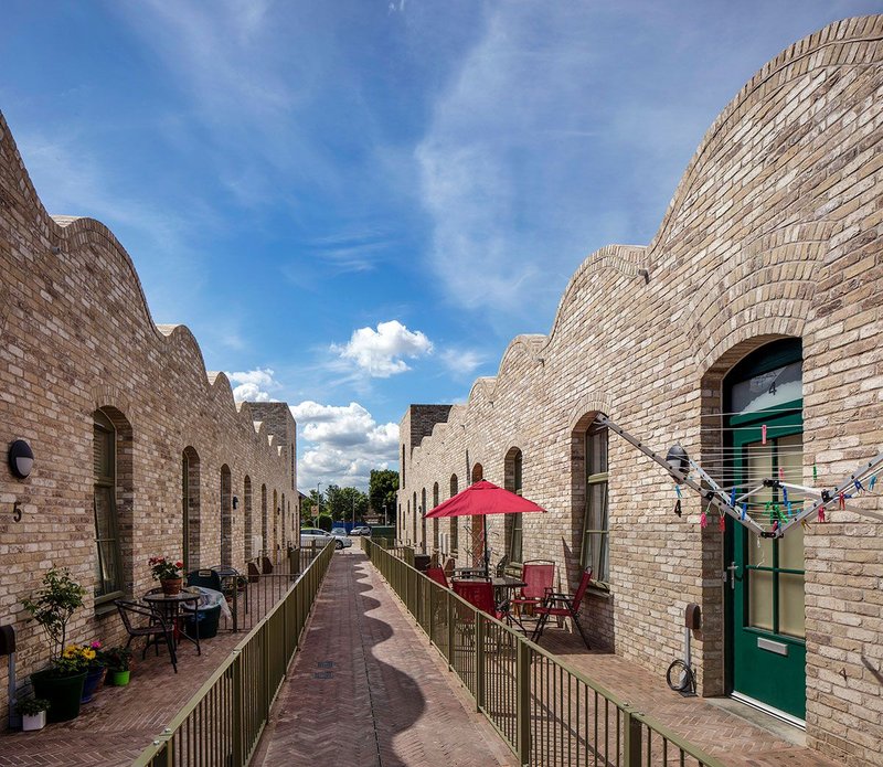 The return of the traffic-free alley: little front yards make a congenial environment for older people.