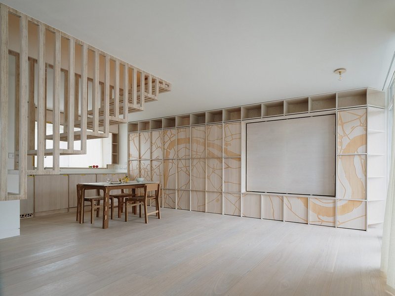 The lower floor has been opened up by removing all internal partitions to exploit the flat’s dual aspect. The floating timber stair leads to the upper floor.