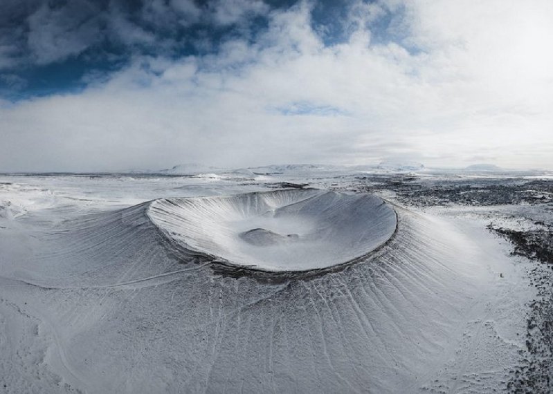 Coffee shop with a difference: Hverfjall was created during a volcano eruption and is almost perfectly symmetrical but for a landslide.