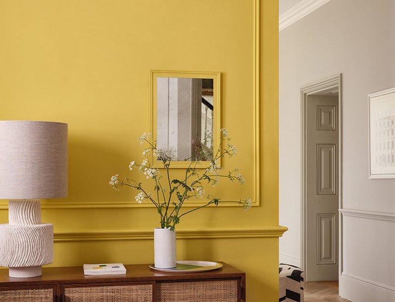 Paint & Paper Library now offers 85 Original Colours, including five bright whites, and 95 Architectural Colours in five numbered gradations of tone. Hallway wall painted in Brimstone; living room wall and door in Salt III; ceiling and coving in Clean White 101.