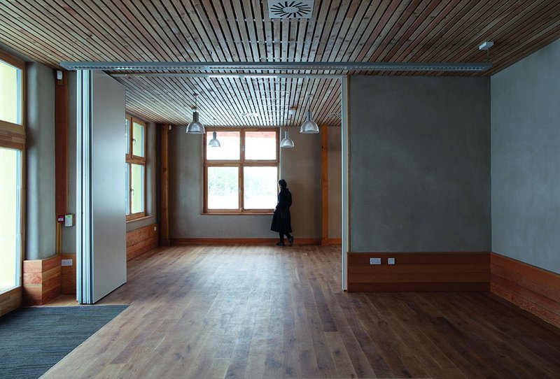 View looking east from the community room through partitions to the café