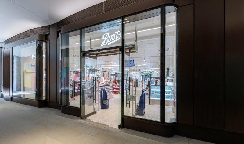 Entrance to the Boots store on High Street Kensington, London: the GEZE UFO NT electromechanical floor-mounted swing door drive is suitable for single leaf doors weighing up to 125kg.