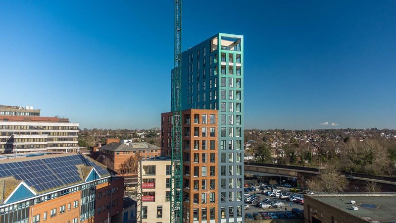 Perigon Heights, Bromley with stepped facades in stone, red brick and turquoise cladding. Main contractor, The Purelake Group. Architect, ECE Architecture.