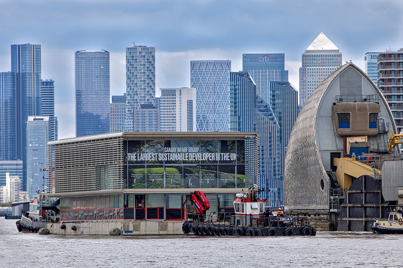 The pavilions were pulled by tug from the construction site in Beckton, via the Thames Barrier and Greenwich to Canary Wharf