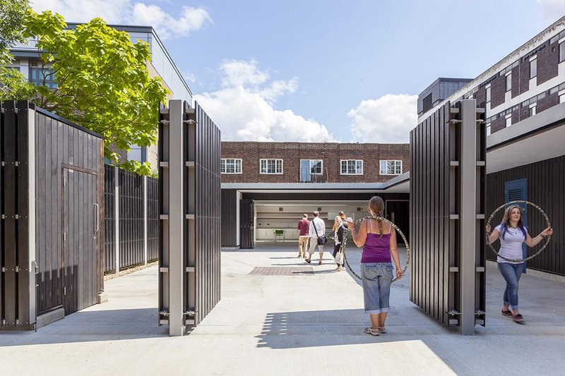 The Rickyard, updated as a community learning centre, opens onto the park.