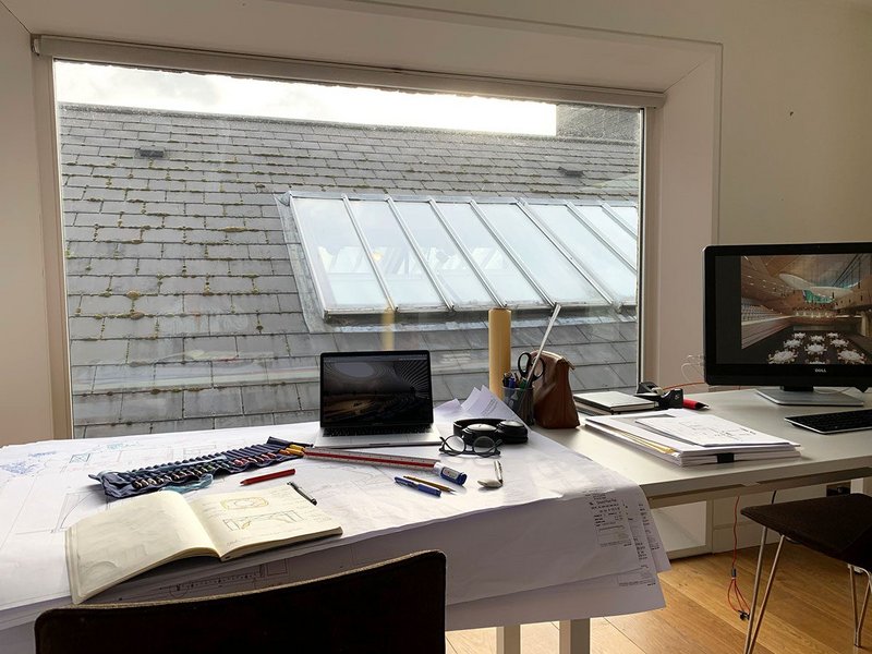 Seilern's home workspace overlooks the living room roof and skylight.