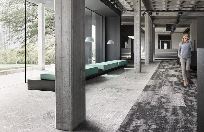 Desso carpet tiles by Tarkett can be used to zone spaces and signal a change of function.