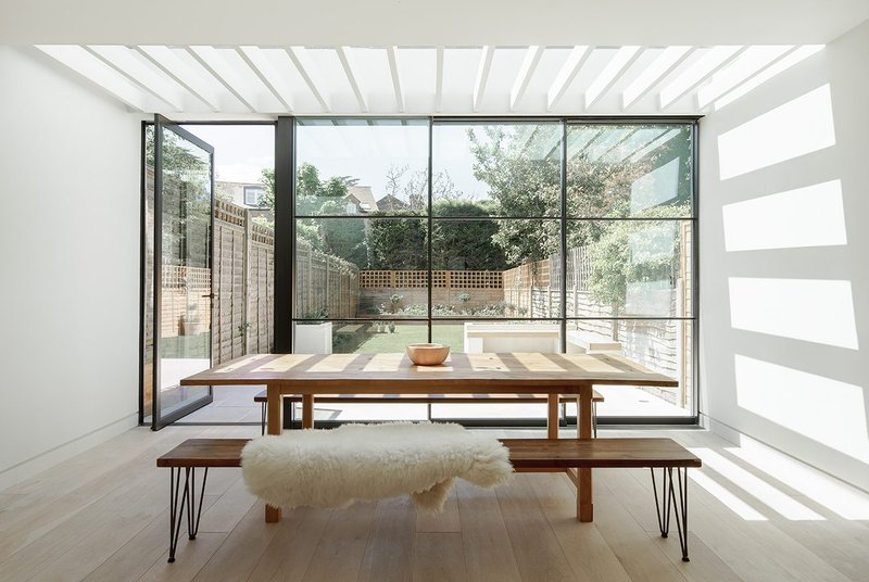 Light fantastic: Minimal frames and slim glazing bars offer a modern update on industrial style at a property in Wandsworth, London. Maxlight pivot and sliding doors.