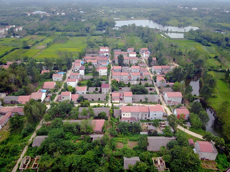 Aerial view of Shigushan village with commune housing gradually replaced by contemporary family houses, 2017.