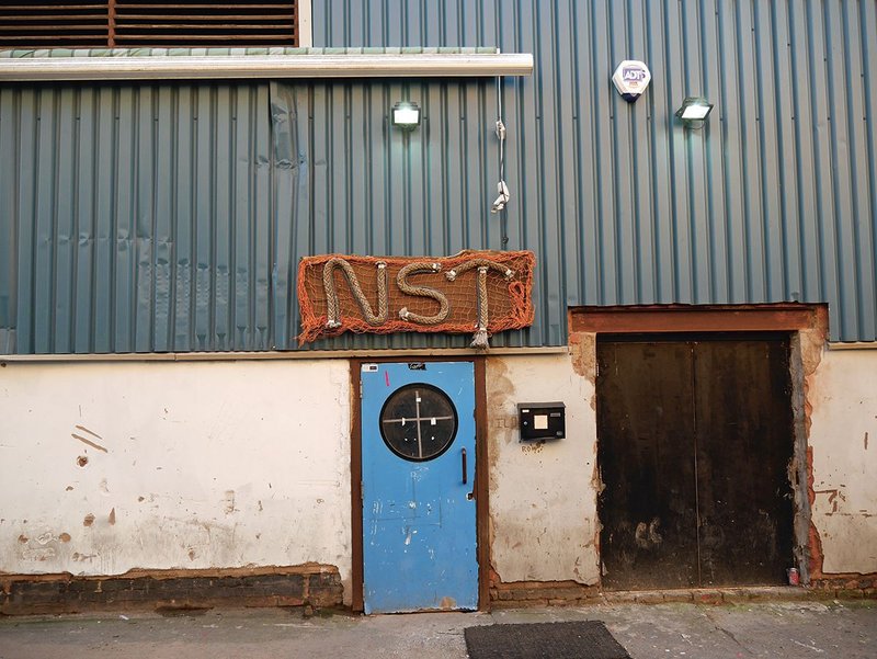 The character of the close-packed Ten Streets area leading inland from the north-central docks is a mix of old and new warehouses, factories and sheds, part derelict and part active, that is now slated for creative industries and cut through with a new pedestrian spine.