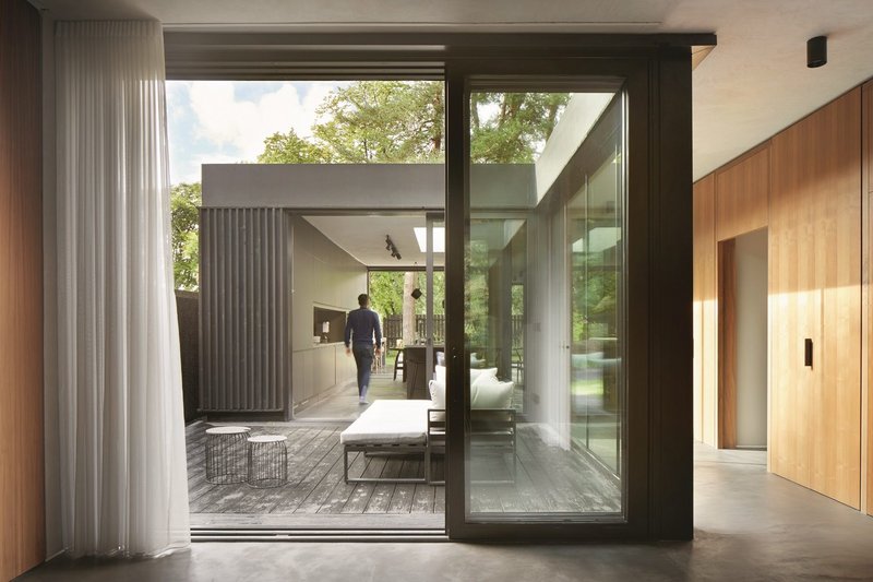 One of three courtyards running along the home’s deep plan, which help blur the distinction between inside and outside.