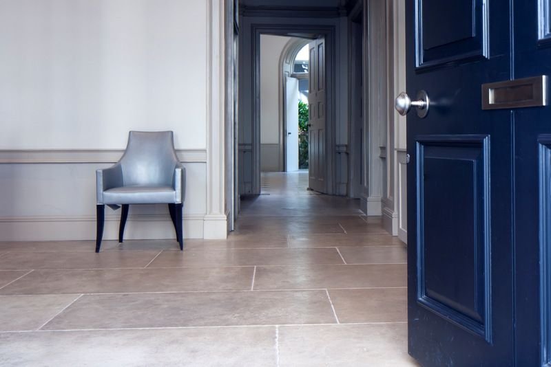 Portland Limestone floor with bespoke patinated finish and 750mm width courses at residential property in Mayfair, London