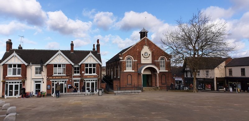 The former Town Hall / Market Hall (right) and Sir Nigel Gresley Pub (left) on Swadlincote High Street, Derbyshire, 2020.