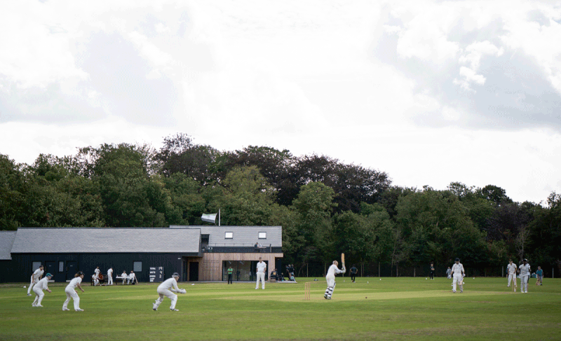 The new pavilion addresses both pitches, but the side glance from the bar here intimates the pitch-pecking order.