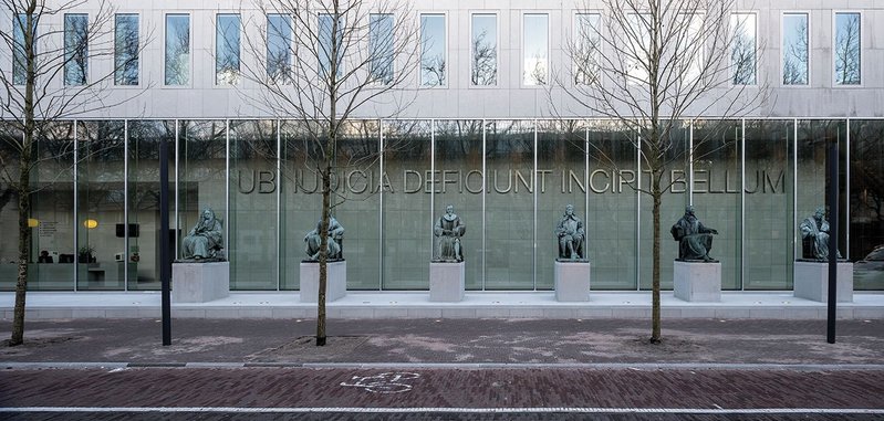 Six Dutch scholars of jurisprudence guard the public entrance to the public lobby.
