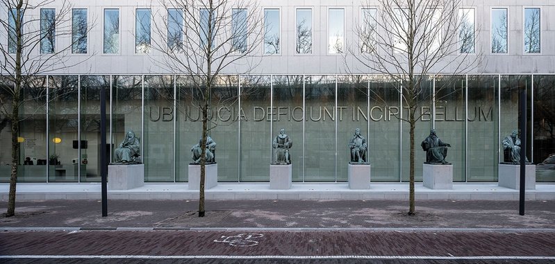 Six Dutch scholars of jurisprudence guard the public entrance to the public lobby.