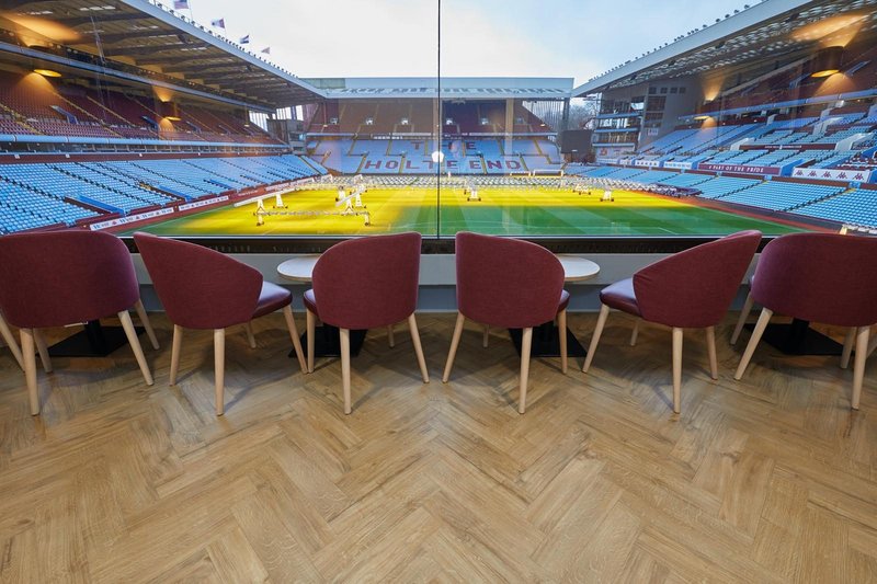 Amtico's Spacia 36+ Featured Oak luxury vinyl tiles fitted in a large parquet laying pattern at Aston Villa Football Club.