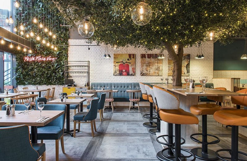 Prezzo's Bracknell branch with Grey Dune Textured Woodgrain and Cool Polished Cement Textured Stone luxury vinyl flooring by Interface.