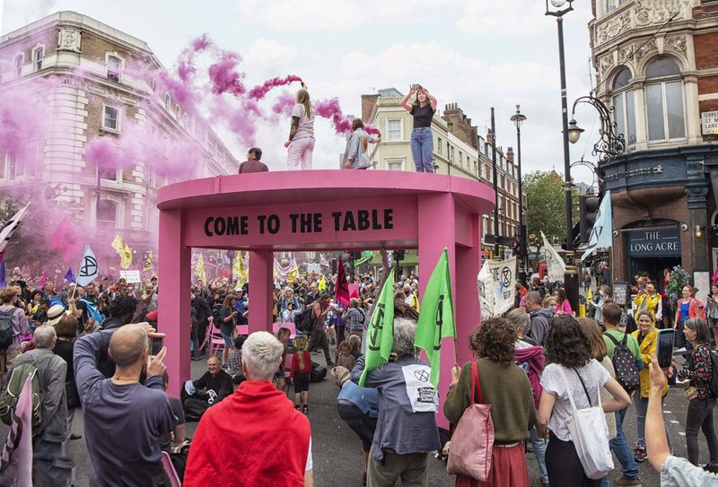 Protesters used a flatbed truck disguised as a Luton van to smuggle an oversized table into central London, as part of Extinction Rebellion’s 2020 ‘Impossible Rebellion’.