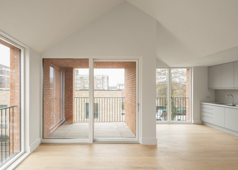 Second floor affordable housing apartment at Tori Ann Walk with vaulted roof and spacious loggia.