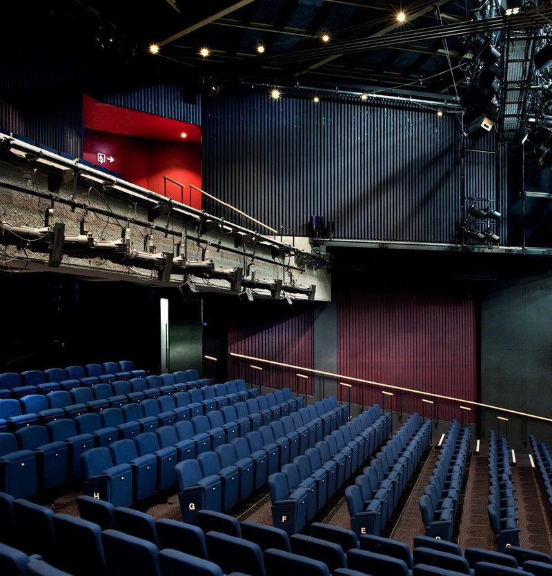 In the auditorium, seating is rearranged with a steeper rake.