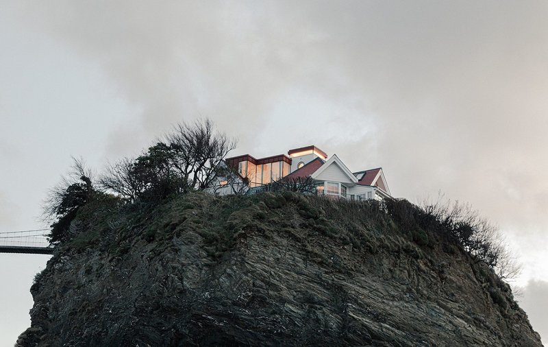 WillGamble/Architects has extended a fairytale holiday home perched atop a craggy island.