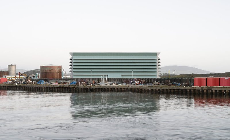 The ‘Ferrybank’ site is bounded to the south by a river quay, to the east by a road and to the north by a sea wall.