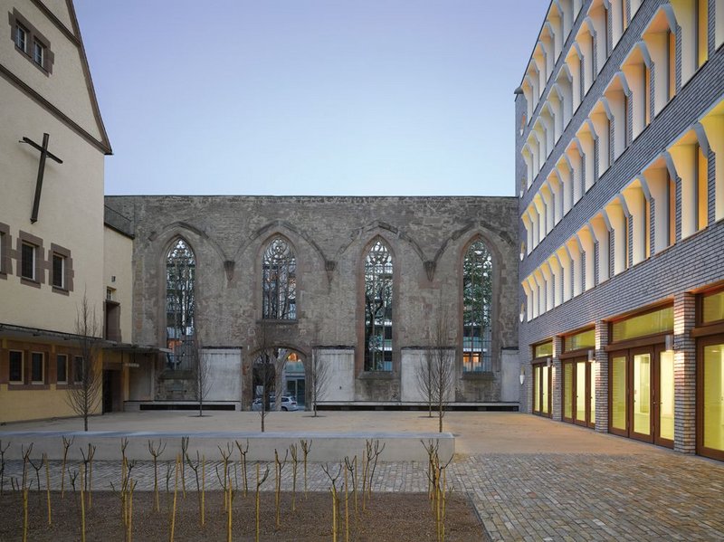 The nave wall of the original Hospitalkirche forms one side of the re-instated and longer courtyard. The west face of the remaining church is planned to have huge glazed openings, bringing it too into the courtyard fold.