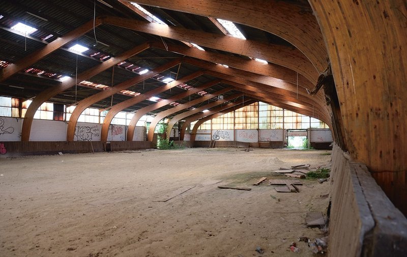 The former equestrian training hall was bought by the client, carefully dismantled, then stored before construction.