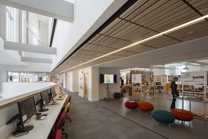 Timber ceilings add a sense of warmth reminscent of school of architecture's previous home