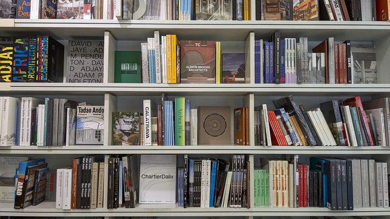 The shelves of monographs in the RIBA Bookshop at 66 Portland Place in London.